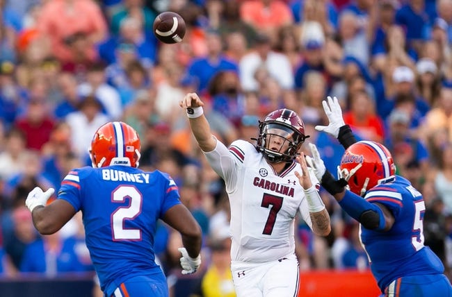 South Carolina Gamecocks quarterback Spencer Rattler (7) passes under pressure in the first half. Florida hosted the South Carolina Gamecocks in the last home game of the season at Ben Hill Griffin Stadium in Gainesville, Florida, on Saturday, November 12, 2022. [Doug Engle/Gainesville Sun]

Ncaa Football Florida Gators Vs South Carolina Gamecocks