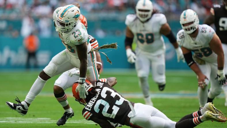 Nov 13, 2022; Miami Gardens, Florida, USA; Cleveland Browns cornerback Martin Emerson Jr. (23) attempts to tackle Miami Dolphins running back Jeff Wilson Jr. (23) during the first half at Hard Rock Stadium. Mandatory Credit: Jasen Vinlove-USA TODAY Sports