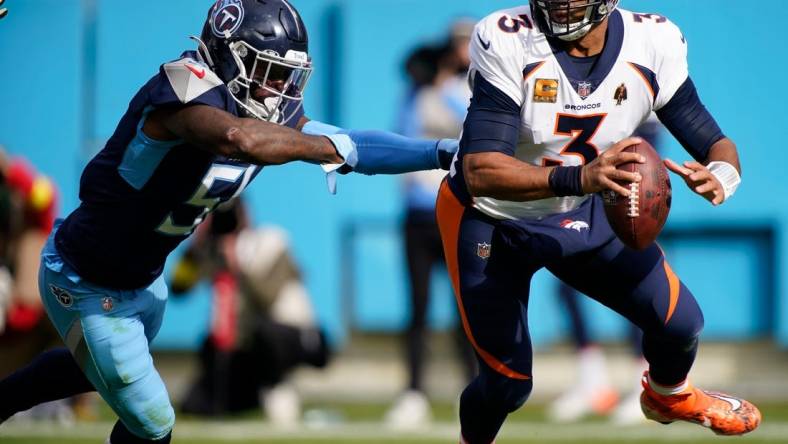 Nov 13, 2022; Nashville, Tennessee, USA; Denver Broncos quarterback Russell Wilson (3) is pressured by Tennessee Titans linebacker David Long Jr. (51) in the second quarter at Nissan Stadium. Mandatory Credit: George Walker IV-USA TODAY Sports