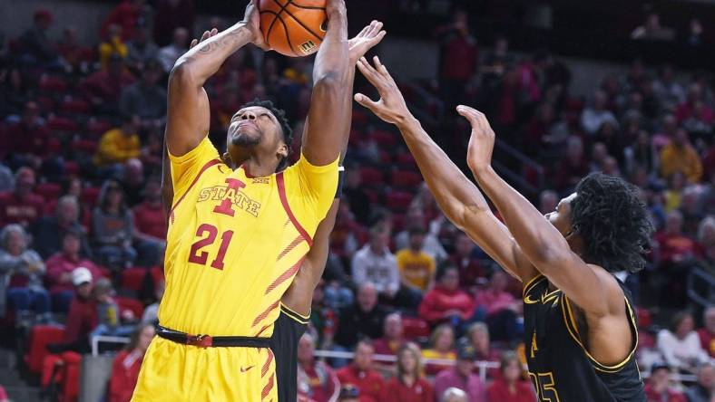 Iowa State University Cyclones center Osun Osunniyi (21) takes a shot around North Carolina A&T Aggies forward Webster Filmore (25) during the first half at Hilton Coliseum Sunday, Nov. 13, 2022, in Ames, Iowa.  Photo by Nirmalendu Majumdar/Ames Tribune

Ncaa Men S Basketball