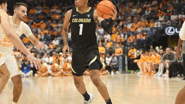 Nov 13, 2022; Nashville, Tennessee, USA;  Colorado Buffaloes guard Julian Hammond III (1) passes the ball against the Tennessee Volunteers during the second half at Bridgestone Arena. Mandatory Credit: Steve Roberts-USA TODAY Sports