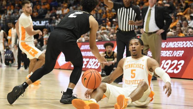 Nov 13, 2022; Nashville, Tennessee, USA;  Colorado Buffaloes guard KJ Simpson (2) is called for a foul as he steals the ball from Tennessee Volunteers guard Zakai Zeigler (5) during the second half at Bridgestone Arena. Mandatory Credit: Steve Roberts-USA TODAY Sports