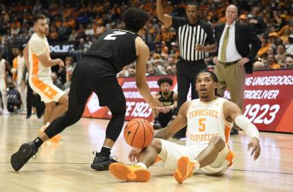 Nov 13, 2022; Nashville, Tennessee, USA;  Colorado Buffaloes guard KJ Simpson (2) is called for a foul as he steals the ball from Tennessee Volunteers guard Zakai Zeigler (5) during the second half at Bridgestone Arena. Mandatory Credit: Steve Roberts-USA TODAY Sports