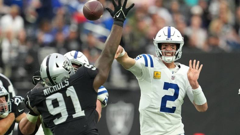 Nov 13, 2022; Paradise, Nevada, USA; Indianapolis Colts quarterback Matt Ryan (2) attempts a pass as Las Vegas Raiders defensive tackle Bilal Nichols (91) looks to deflect the play during the first half at Allegiant Stadium. Mandatory Credit: Stephen R. Sylvanie-USA TODAY Sports