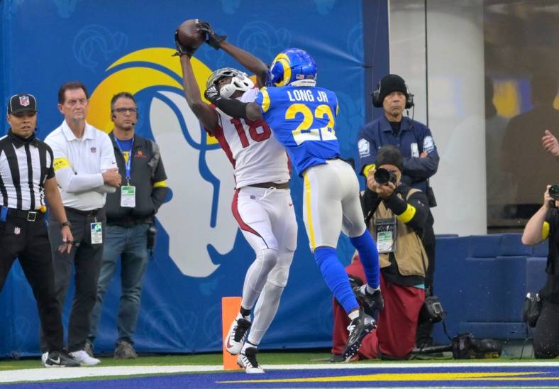 Nov 13, 2022; Inglewood, California, USA;  Arizona Cardinals wide receiver A.J. Green (18) catches the ball in front of Los Angeles Rams cornerback David Long Jr. (22) for a touchdown in the first half at SoFi Stadium. Mandatory Credit: Jayne Kamin-Oncea-USA TODAY Sports