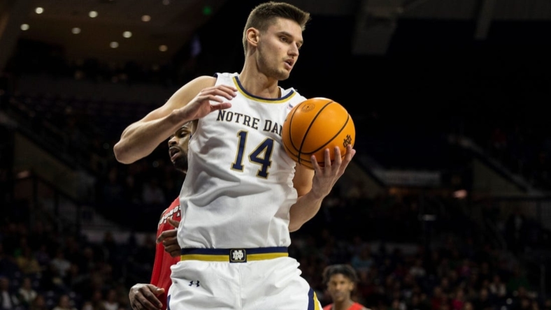 Notre Dame forward Nate Laszewski (14) grabs a rebound during the Youngstown State-Notre Dame NCAA Men's basketball game on Sunday, November 13, 2022, at Purcell Pavilion in South Bend, Indiana.

Youngstown State Vs Notre Dame