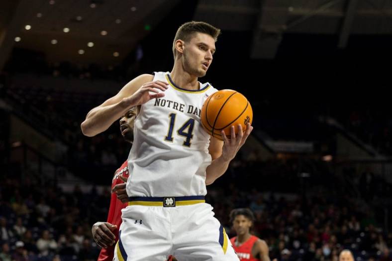 Notre Dame forward Nate Laszewski (14) grabs a rebound during the Youngstown State-Notre Dame NCAA Men's basketball game on Sunday, November 13, 2022, at Purcell Pavilion in South Bend, Indiana.

Youngstown State Vs Notre Dame