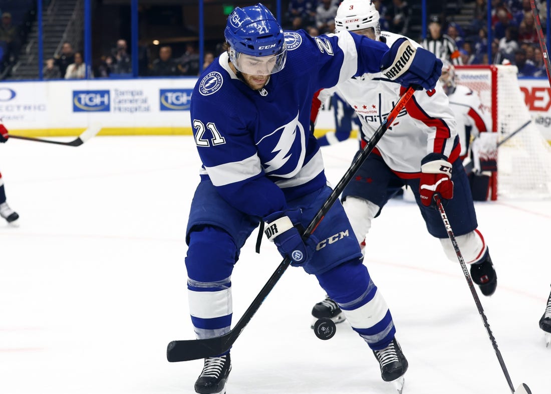 Nov 13, 2022; Tampa, Florida, USA; Tampa Bay Lightning center Brayden Point (21) skates after the puck against the Washington Capitals during the third period at Amalie Arena. Mandatory Credit: Kim Klement-USA TODAY Sports