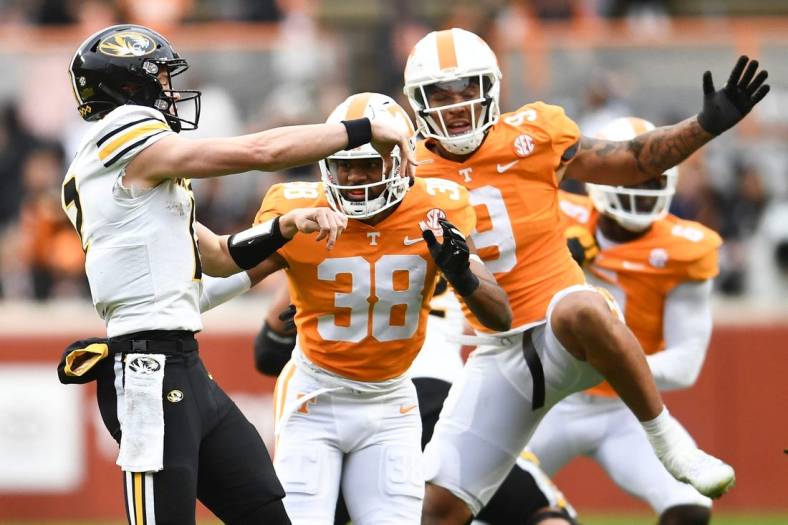 Tennessee linebacker Solon Page III (38) and defensive lineman/linebacker Tyler Baron (9) pressure Missouri quarterback Brady Cook (12) during an NCAA college football game on Saturday, November 12, 2022 in Knoxville, Tenn.

Ut Vs Missouri