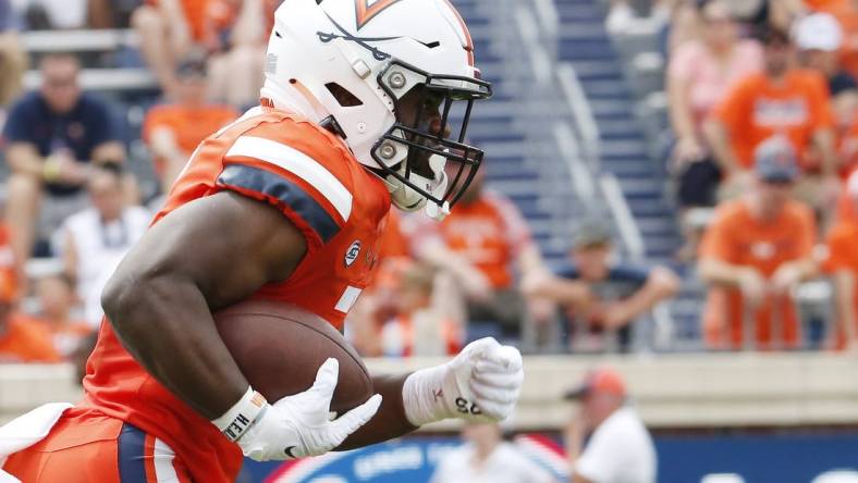 Sep 3, 2022; Charlottesville, Virginia, USA; Virginia Cavaliers running back Mike Hollins (7) carries the ball during the first half against the Richmond Spiders at Scott Stadium. Mandatory Credit: Amber Searls-USA TODAY Sports