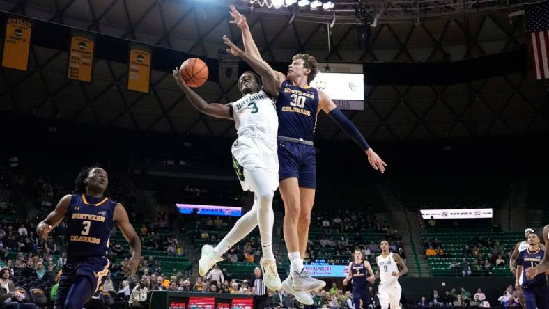 Nov 14, 2022; Waco, Texas, USA;  Baylor Bears guard Dale Bonner (3) drives to the basket and is fouled by Northern Colorado Bears guard Caleb Shaw (30) during the first half at Ferrell Center. Mandatory Credit: Chris Jones-USA TODAY Sports