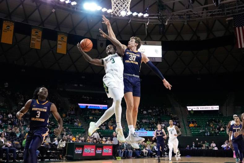 Nov 14, 2022; Waco, Texas, USA;  Baylor Bears guard Dale Bonner (3) drives to the basket and is fouled by Northern Colorado Bears guard Caleb Shaw (30) during the first half at Ferrell Center. Mandatory Credit: Chris Jones-USA TODAY Sports