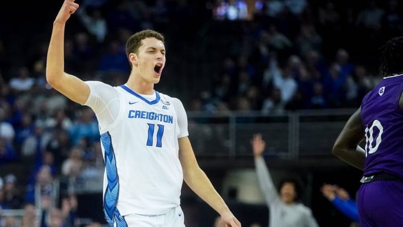 Nov 14, 2022; Omaha, Nebraska, USA; Creighton Bluejays center Ryan Kalkbrenner (11) celebrates after a 3-pointer against the Holy Cross Crusaders during the first half at CHI Health Center Omaha. Mandatory Credit: Dylan Widger-USA TODAY Sports