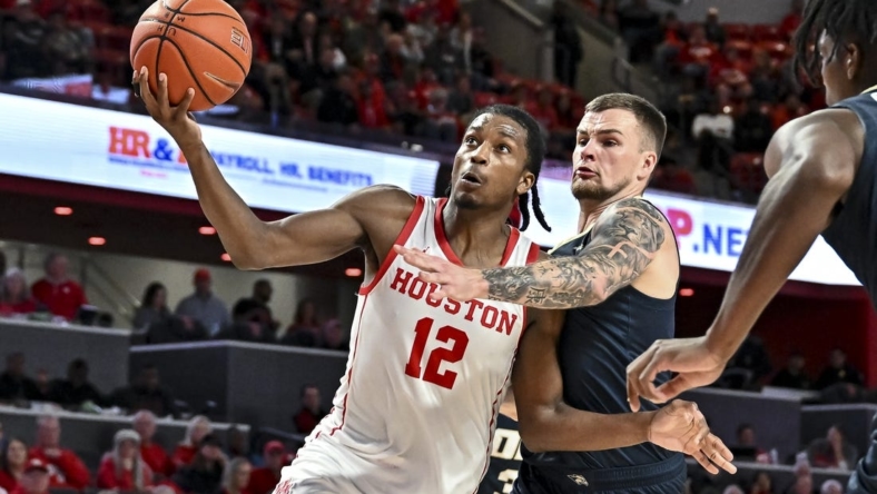 Nov 14, 2022; Houston, Texas, USA; Houston Cougars guard Tramon Mark (12) goes up for the lay up during the second half against the Oral Roberts Golden Eagles at Fertitta Center. Mandatory Credit: Maria Lysaker-USA TODAY Sports