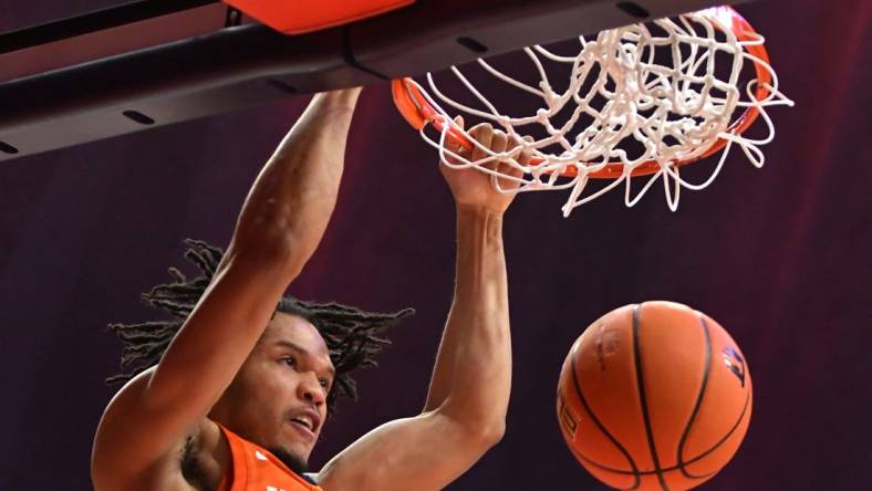 Nov 14, 2022; Champaign, Illinois, USA;  Illinois Fighting Illini guard Ty Rodgers (20) dunks during the first half against the Monmouth Hawks State Farm Center. Mandatory Credit: Ron Johnson-USA TODAY Sports