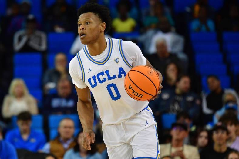 Nov 14, 2022; Los Angeles, California, USA; UCLA Bruins guard Jaylen Clark (0) moves the ball up court against the Norfolk State Spartans during the first half at Pauley Pavilion. Mandatory Credit: Gary A. Vasquez-USA TODAY Sports