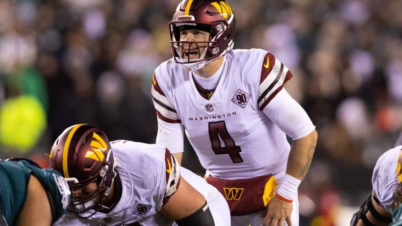 Nov 14, 2022; Philadelphia, Pennsylvania, USA; Washington Commanders quarterback Taylor Heinicke (4) prepares to snap the ball during the third quarter against the Philadelphia Eagles at Lincoln Financial Field. Mandatory Credit: Bill Streicher-USA TODAY Sports