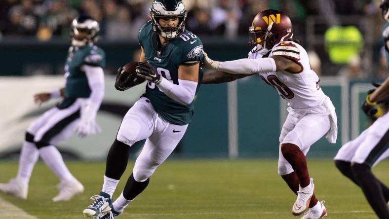 Nov 14, 2022; Philadelphia, Pennsylvania, USA; Philadelphia Eagles tight end Dallas Goedert (88) runs with the ball against Washington Commanders safety Bobby McCain (20) after a catch during the third quarter at Lincoln Financial Field. Mandatory Credit: Bill Streicher-USA TODAY Sports