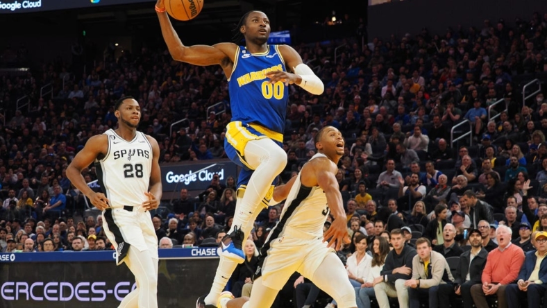 Nov 14, 2022; San Francisco, California, USA; Golden State Warriors forward Jonathan Kuminga (00) drives for a dunk against the San Antonio Spurs during the third quarter at Chase Center. Mandatory Credit: Kelley L Cox-USA TODAY Sports