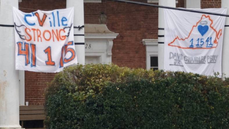 Nov 15, 2022; Charlottesville, Virginia, US; A memorial sign is displayed on a Greek house near the site where three Virginia Cavaliers football players were killed in a shooting on the grounds of the University of Virginia in Charlottesville. Mandatory Credit: Geoff Burke-USA TODAY NETWORK