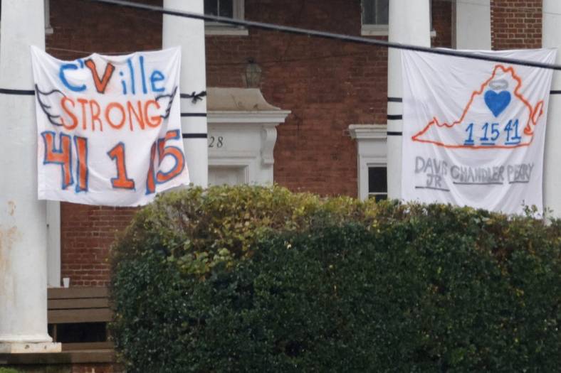 Nov 15, 2022; Charlottesville, Virginia, US; A memorial sign is displayed on a Greek house near the site where three Virginia Cavaliers football players were killed in a shooting on the grounds of the University of Virginia in Charlottesville. Mandatory Credit: Geoff Burke-USA TODAY NETWORK