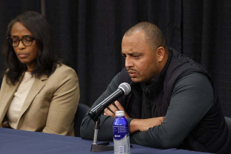 Nov 15, 2022; Charlottesville, Virginia, US; Virginia Cavaliers head coach Tony Elliott (R) answers a question from the media as Cavaliers athletic director Carla Williams (L) listens during a press conference regarding the deaths of three Cavaliers players from a shooting on the university grounds late Sunday night in Charlottesville. Mandatory Credit: Geoff Burke-USA TODAY NETWORK