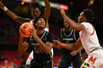 Nov 15, 2022; College Park, Maryland, USA;  Binghamton Bearcats guard Masud Stewart (4) looks to shoot as Maryland Terrapins guard Jahmir Young (1) defends during the first half at Xfinity Center. Mandatory Credit: Tommy Gilligan-USA TODAY Sports