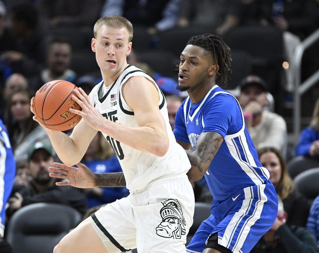 Nov 15, 2022; Indianapolis, Indiana, USA;  Kentucky Wildcats forward Daimion Collins (4) guards Michigan State Spartans forward Joey Hauser (10) during the first half at Gainbridge Fieldhouse. Mandatory Credit: Marc Lebryk-USA TODAY Sports