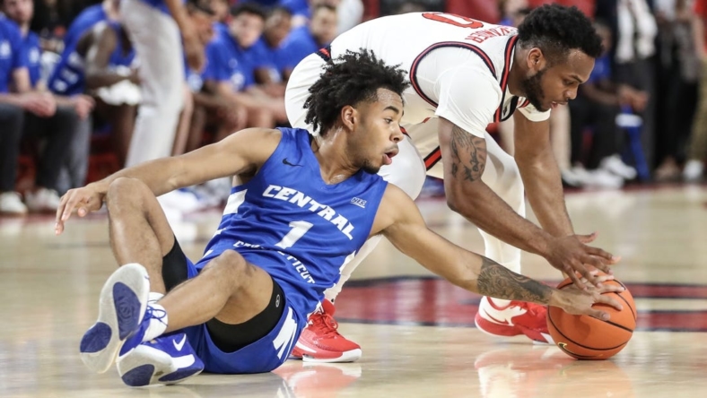 Nov 15, 2022; Queens, New York, USA;  St. John's Red Storm guard Posh Alexander (0) and Central Connecticut State Blue Devils guard Jay Rodgers (1) fight for a loose ball in the first half at Carnesecca Arena. Mandatory Credit: Wendell Cruz-USA TODAY Sports