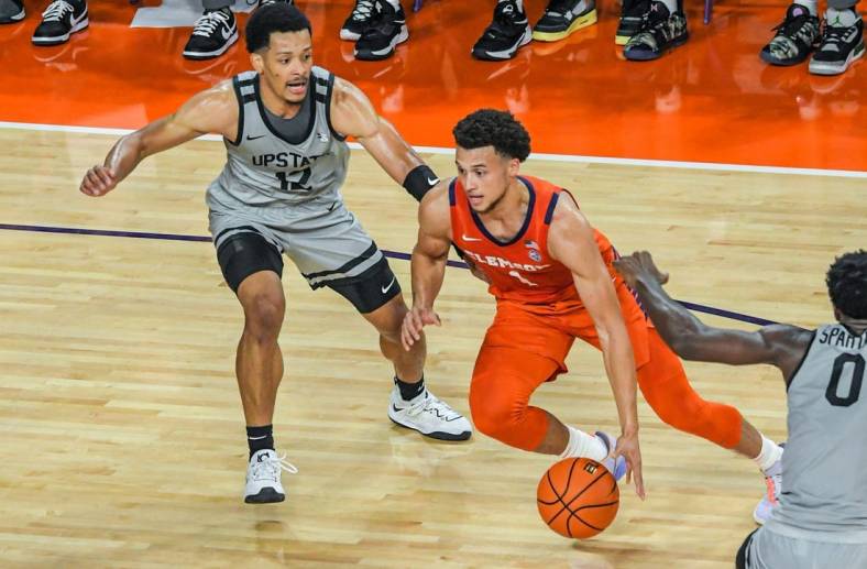 Clemson junior guard Chase Hunter (1) dribbles near USC Upstate guard Trae Broadnax (12) during the first half at Littlejohn Coliseum Tuesday, November 15, 2022.

Ncaa Acc Clemson Basketball Vs Usc Upstate