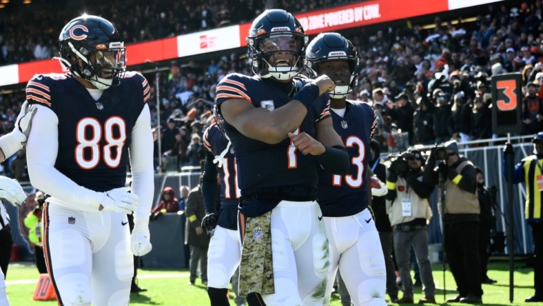 Nov 13, 2022; Chicago, Illinois, USA;  Chicago Bears quarterback Justin Fields (1) celebrates with  Chicago Bears tight end Trevon Wesco (88) and Chicago Bears wide receiver Byron Pringle (13) after he scores a touchdownn against the Detroit Lions during the first half at Soldier Field. Mandatory Credit: Matt Marton-USA TODAY Sports