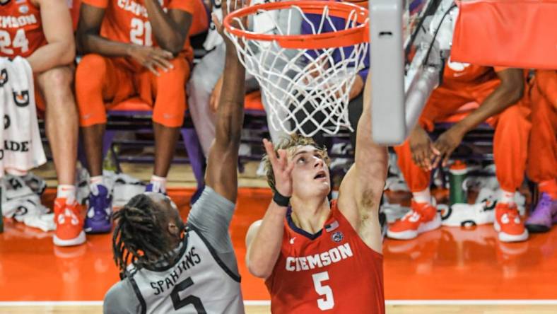 Clemson forward Hunter Tyson (5) shoots near USC Upstate guard Jordyn Surratt (5) during the second half at Littlejohn Coliseum Tuesday, November 15, 2022.

Ncaa Acc Clemson Basketball Vs Usc Upstate