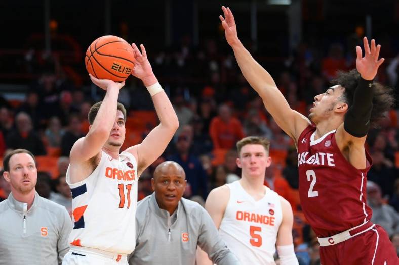 Nov 15, 2022; Syracuse, New York, USA; Syracuse Orange guard Joseph Girard III (11) shoots the ball against the defense of Colgate Raiders guard Braeden Smith (2) during the second half at the JMA Wireless Dome. Mandatory Credit: Rich Barnes-USA TODAY Sports