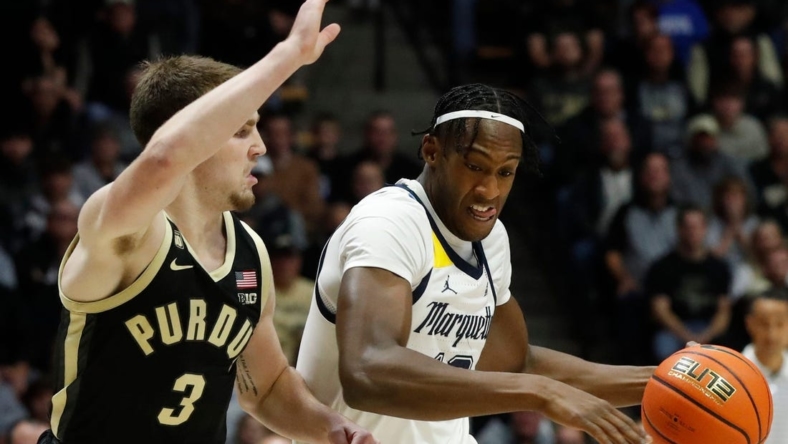 Marquette Golden Eagles forward Olivier-Maxence Prosper (12) drives to the basket during the NCAA men   s basketball game against the Purdue Boilermakers, Tuesday, Nov. 15, 2022, at Mackey Arena in West Lafayette, Ind.

Purduemarquettembb111522 Am34268