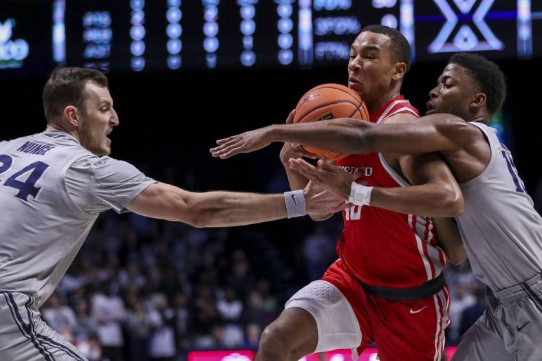 Nov 15, 2022; Cincinnati, Ohio, USA; Xavier Musketeers forward Jack Nunge (24) and guard KyKy Tandy (15) battle for the ball against Fairfield Stags forward Allan Jeanne-Rose (10) in the first half at Cintas Center. Mandatory Credit: Katie Stratman-USA TODAY Sports