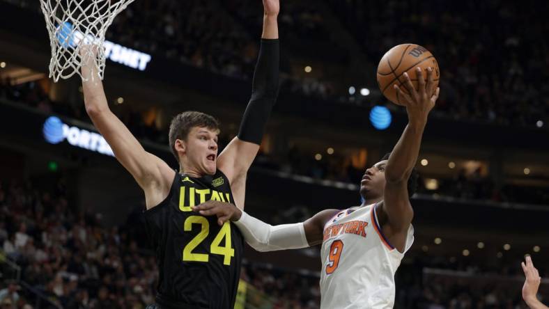 Nov 15, 2022; Salt Lake City, Utah, USA;  Utah Jazz center Walker Kessler (24) tries to block the shot of New York Knicks guard RJ Barrett (9) during the second quarter at Vivint Arena. Mandatory Credit: Chris Nicoll-USA TODAY Sports