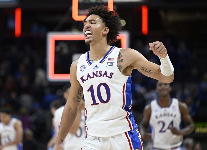 Nov 15, 2022; Indianapolis, Indiana, USA;  Kansas Jayhawks forward Jalen Wilson (10) reacts to defeating the Duke Blue Devils after the game at Gainbridge Fieldhouse. Jayhawks defeat the Blue Devils 69 to 64. Mandatory Credit: Marc Lebryk-USA TODAY Sports