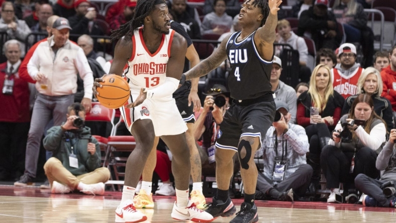 Nov 16, 2022; Columbus, Ohio, USA; Ohio State Buckeyes guard Isaac Likekele (13) looks for an open teammate as Eastern Illinois Panthers guard Yaakema Rose Jr. (4) defends in the first half at Value City Arena. Mandatory Credit: Greg Bartram-USA TODAY Sports
