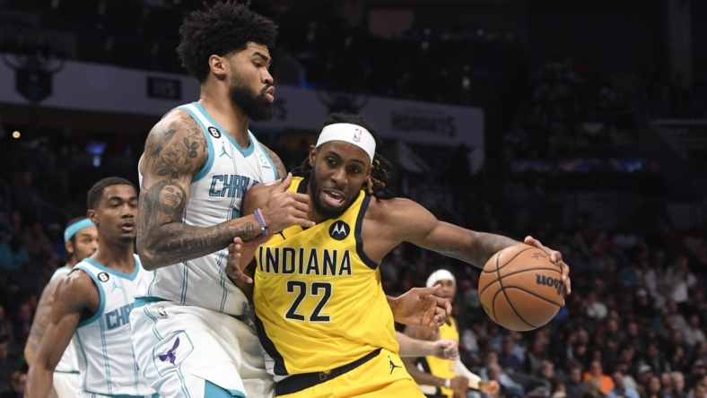 Nov 16, 2022; Charlotte, North Carolina, USA; Indiana Pacers forward Isaiah Jackson (22) drives on Charlotte Hornets center Nick Richards (4) during the first half at the Spectrum Center. Mandatory Credit: Sam Sharpe-USA TODAY Sports
