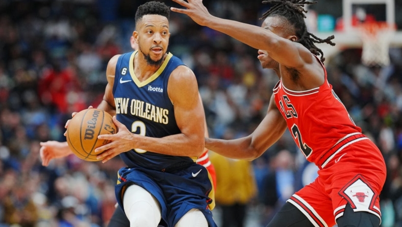 Nov 16, 2022; New Orleans, Louisiana, USA; New Orleans Pelicans guard CJ McCollum (3) fights for position against Chicago Bulls guard Ayo Dosunmu (12) during the second quarter at Smoothie King Center. Mandatory Credit: Andrew Wevers-USA TODAY Sports