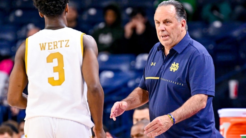 Nov 16, 2022; South Bend, Indiana, USA; Notre Dame Fighting Irish head coach Mike Brey talks to guard Trey Wertz (3) in the second half against the Southern Indiana Screaming Eagles at the Purcell Pavilion. Mandatory Credit: Matt Cashore-USA TODAY Sports