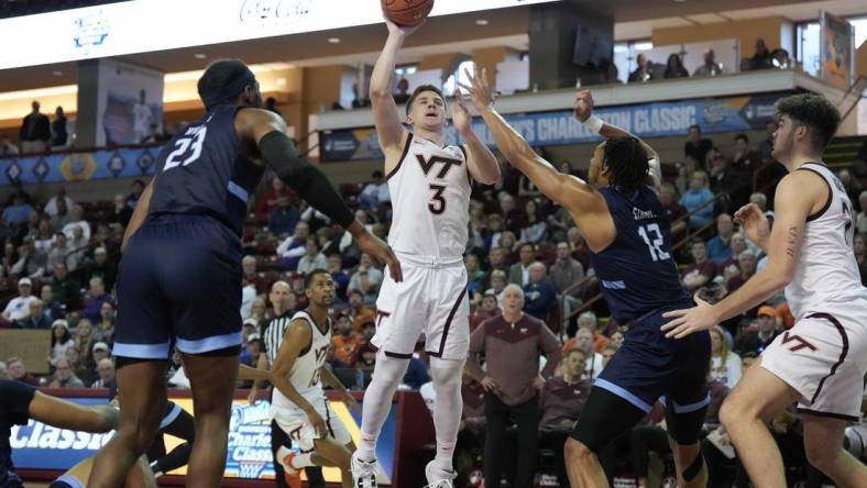 Nov 17, 2022; Charleston, South Carolina, USA; Virginia Tech Hokies guard Sean Pedulla (3) shoots the ball over Old Dominion Monarchs forward Ben Stanley (12) in the second half at TD Arena. Mandatory Credit: David Yeazell-USA TODAY Sports