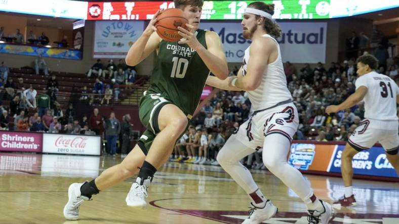 Nov 17, 2022; Charleston, South Carolina, USA; Colorado State Rams forward James Moors (10) drives the ball in the first half against a South Carolina Gamecocks defender at TD Arena. Mandatory Credit: David Yeazell-USA TODAY Sports