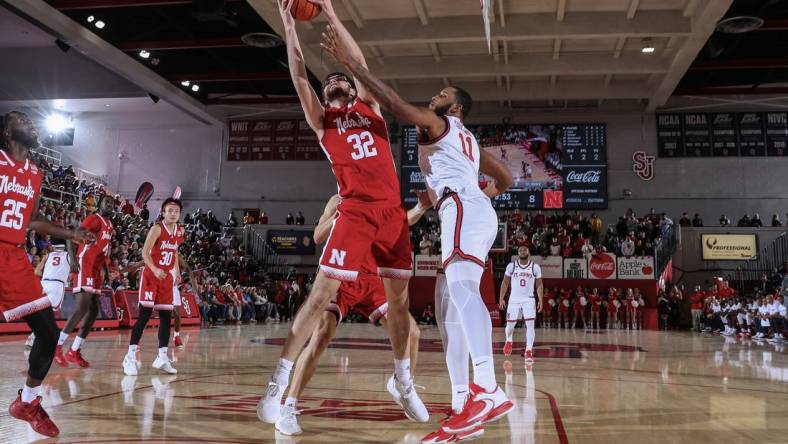 Nov 17, 2022; Queens, New York, USA; Nebraska Cornhuskers forward Wilhelm Breidenbach (32) and St. John's Red Storm center Joel Soriano (11) battle for a rebound in the first half at Carnesecca Arena. Mandatory Credit: Wendell Cruz-USA TODAY Sports