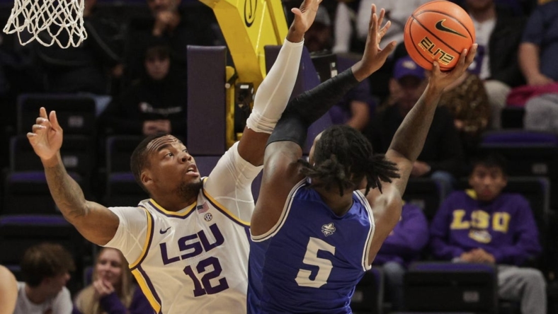 Nov 17, 2022; Baton Rouge, Louisiana, USA; LSU Tigers forward Mwani Wilkinson (5) shoots the ball against LSU Tigers forward KJ Williams (12) during the first half at Pete Maravich Assembly Center. Mandatory Credit: Stephen Lew-USA TODAY Sports