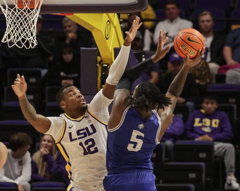 Nov 17, 2022; Baton Rouge, Louisiana, USA; LSU Tigers forward Mwani Wilkinson (5) shoots the ball against LSU Tigers forward KJ Williams (12) during the first half at Pete Maravich Assembly Center. Mandatory Credit: Stephen Lew-USA TODAY Sports