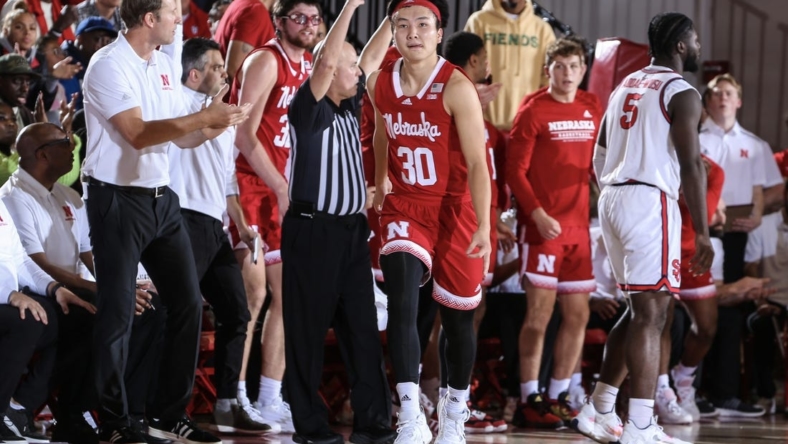 Nov 17, 2022; Queens, New York, USA; Nebraska Cornhuskers guard Keisei Tominaga (30) celebrates after making a three point in the second half against the Nebraska Cornhuskers at Carnesecca Arena. Mandatory Credit: Wendell Cruz-USA TODAY Sports