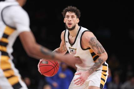 Nov 17, 2022; Brooklyn, New York, USA; (Editors Notes: Caption Correction) Virginia Commonwealth Rams forward Brandon Johns Jr. (30) dribbles during the second half against the Pittsburgh Panthers at Barclays Center. Mandatory Credit: Vincent Carchietta-USA TODAY Sports