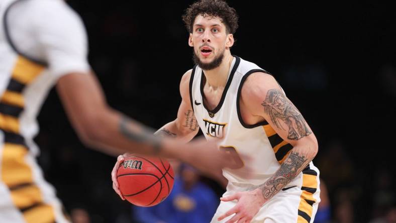 Nov 17, 2022; Brooklyn, New York, USA; (Editors Notes: Caption Correction) Virginia Commonwealth Rams forward Brandon Johns Jr. (30) dribbles during the second half against the Pittsburgh Panthers at Barclays Center. Mandatory Credit: Vincent Carchietta-USA TODAY Sports