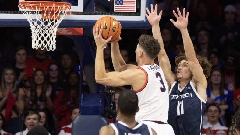 Nov 17, 2022; Tucson, Arizona, USA; University of Arizona Wildcats guard Pelle Larsson (3) goes up for a shot against Utah Tech guard Noa Gonsalves (11) in the first half at McKale Center. Mandatory Credit: David Cruz-USA TODAY Sports